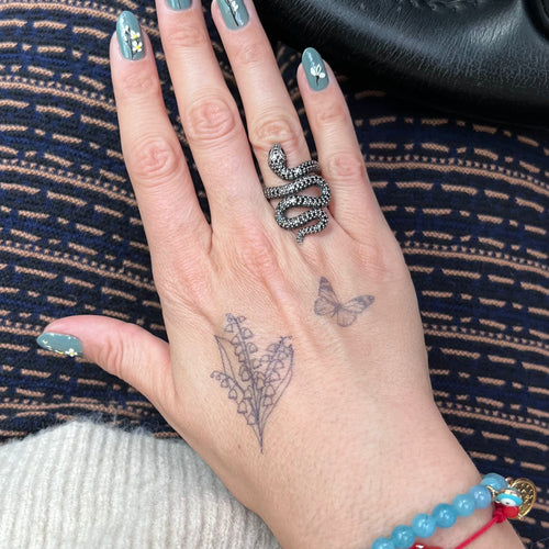 Tatuaggio con mughetto
